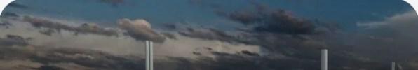 Industrial facility under a cloudy sky