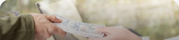 Hands exchanging banknotes