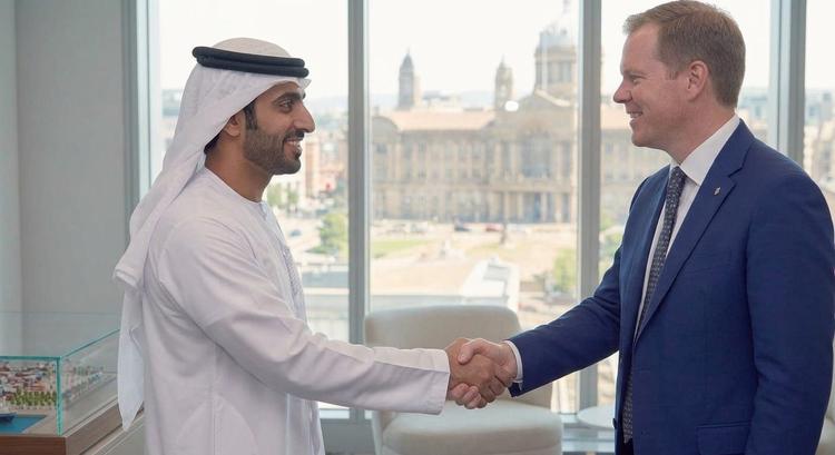 Two delegates shaking hands